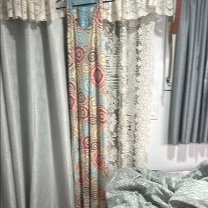 Elegant Spiral Patterned Curtain in Red, Blue, and Cream
